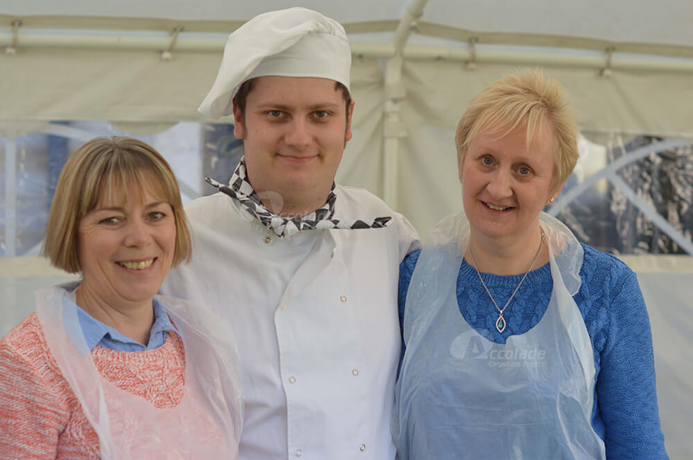 Two ladies with chef at Company Bake Off team building event