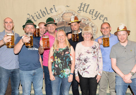 Group in Front of Backdrop German Beer Festival Corporate Event