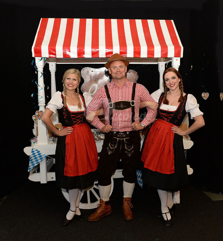 Man in lederhosen and Fraulines and German Beer Festival Event