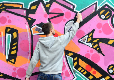 Man painting graffiti for Graffiti workshop event