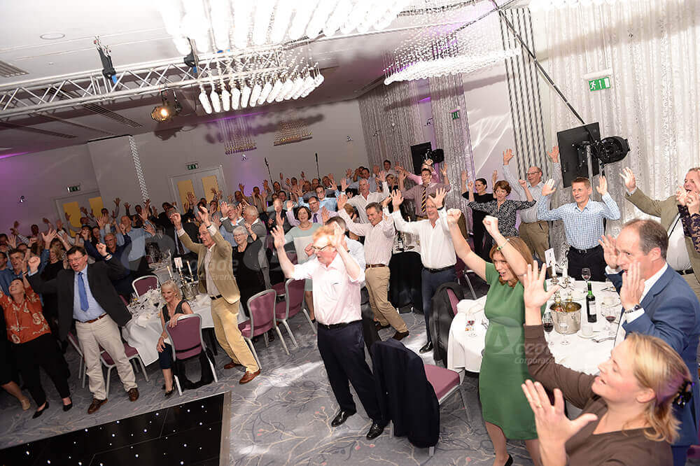 Group learning the Haka at corporate event