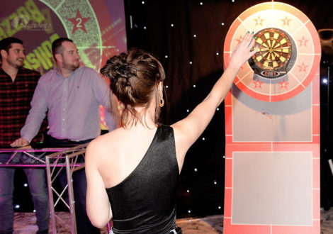 Lady throwing darts at Bullseye corporate event