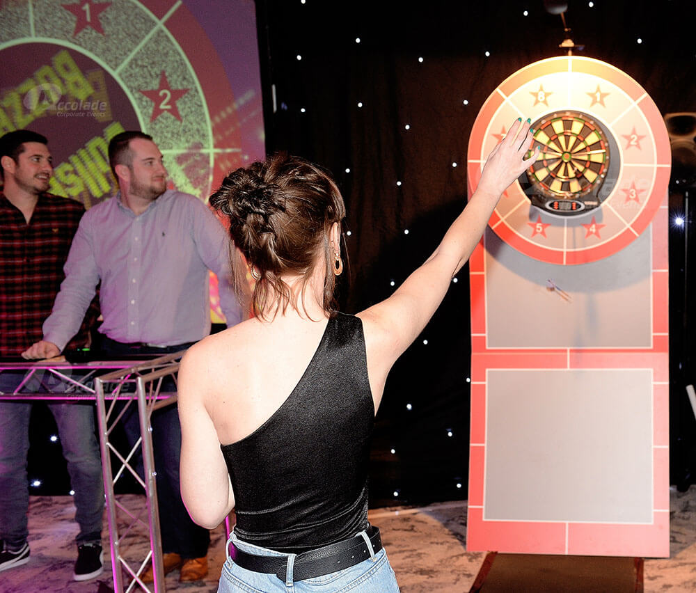 Lady throwing darts at Bullseye corporate event