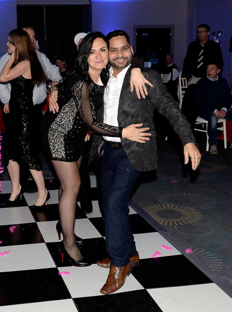 man and woman posing on dancefloor